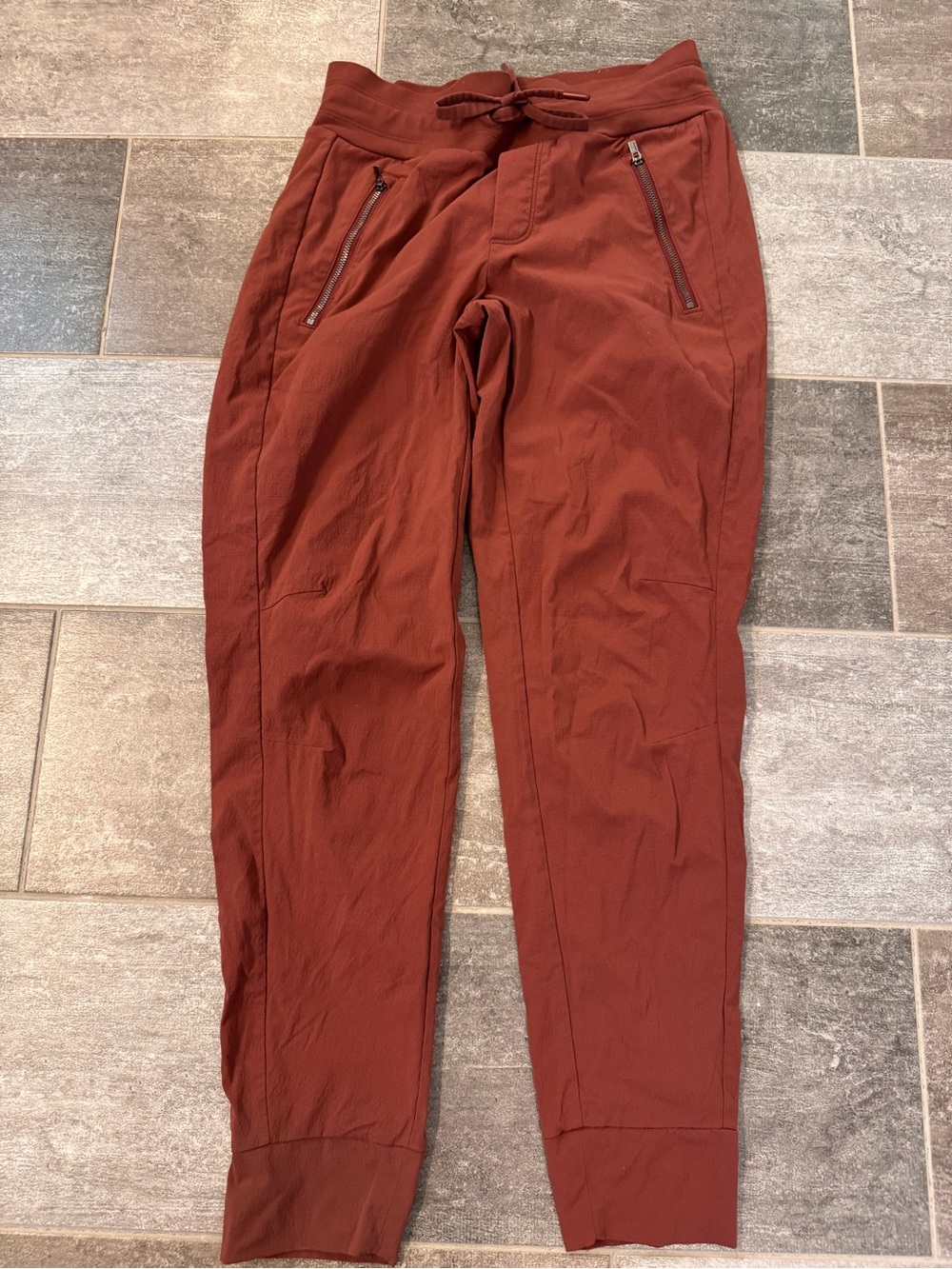 Athleta Womens trekkie north jogger, rust color, side zippered pockets